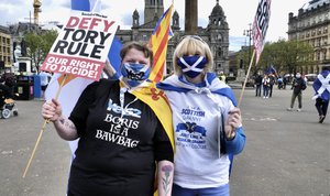 Scottish independence supporters attend a rally in Glasgow, Scotland, Saturday, May 1, 2021.