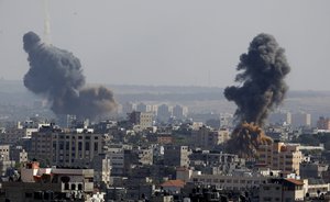 Smoke rises after Israeli airstrikes in Gaza in Gaza City, Tuesday, May 11, 2021