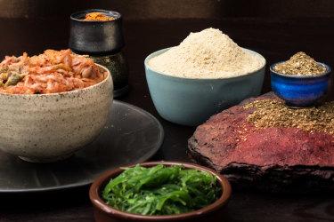 The new essential pantry items for 2021 (clockwise from left): Kimchi, shichimi togarashi, chickpea flour, zaatar and seaweed.