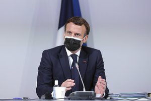 France's President Emmanuel Macron delivers a speech during a Citizens' Convention on Climate, in Paris, Monday, Dec. 14