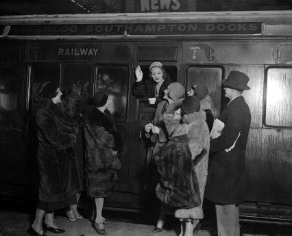 January 1931, American actress Miss Tallulah Bankhead pictured waving as she leaves Waterloo Station on a train, en route for the USA