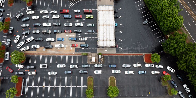 Image: Drivers wait in line to refuel vehicles at a Costco Wholesale Corp. gas station in Dunwoody, Ga., on May 12, 2021.