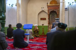 Uyghurs and other members of the faithful pray during services at the Id Kah Mosque in Kashgar in western China's Xinjiang Uyghur Autonomous Region, as seen during a government organized visit for foreign journalists on April 19, 2021