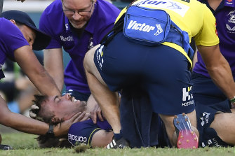 Ryan Papenhuyzen receives medical attention after Tyrell Fuimaono’s hit.