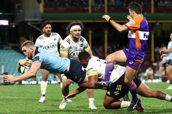 Lachlan Swinton of the Waratahs scores against the Hurricanes at the SCG.