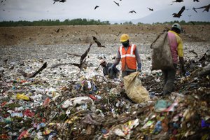 Indian laborers sort through the heaps of waste at the city's lone landfill site on April 30, 2015 in Srinagar, the summer capital of Indian administered Kashmir, India. Kashmir has witnessed huge influx of poor migrant laborers from different parts of India over the past few decades. Living below poverty line and with little access to education or sanitary living conditions, whole families, including children, mostly from different Indian states collect scrap to make a living. These Indian laborers sort through heaps of waste at a landfill site in Srinagar, where an average 400 metric tonnes of solid waste is dumped on daily basis. Working at landfill sites can be hazardous and many of laborers do manual scavenging without basic precautionary equipment. Although the Indian economy has seen significant growth, there are still millions of people who survive on less than $1 (63 INR) a day. International Workers' Day, also known as Labour Day in some places is marked on May 1, 2015.