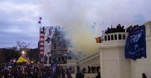 File - Tear gas is seen outside the United States Capitol. On January 6, 2021, rioters supporting United States President Donald Trump's attempts to overturn the 2020 presidential election stormed the U.S. Capitol.