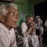 People discuss how to handle the pandemic in the village of Basi, Uttar Pradesh, India.