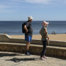 Nice to be back: a couple look at the beach in Albufeira, in Portugal’s southern Algarve region.