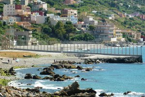 File - View of the coastal Ceuta border fence. Ceuta is a Spanish autonomous city on the north coast of Africa, bordered by Morocco, it lies along the boundary between the Mediterranean Sea and the Atlantic Ocean.