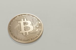 Round gold-colored Bitcoin