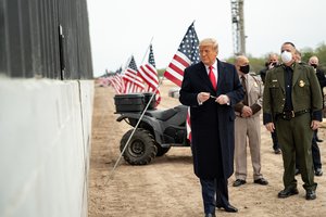 File - President Donald J. Trump prepares to sign a plaque placed along the border wall Tuesday, Jan. 12, 2021, at the Texas-Mexico border near Alamo, Texas.