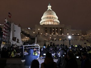 Riot police with shields form a barrier againt protesters, United States Capitol, Washington, D.C, January 6, 2021. Rioters supporting United States President Donald Trump's attempts to overturn the 2020 presidential election stormed and occupied the Capitol. More than 140 people were injured in the storming, while five people died either shortly before, during, or after the event.