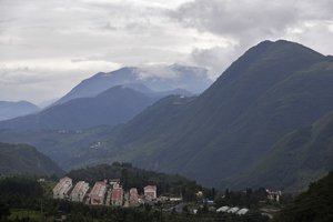 New village houses built by the Chinese government for ethnic monitory sit on the mountain in Ganluo county, southwest China's Sichuan province on Sept. 10, 2020