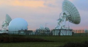 File - Taken at dawn facing east showing the sunrise behind the dishes of GCHQ Bude at Cleave Camp, Morwenstow, Cornwall, UK.