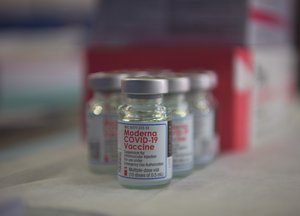 Vials containing the Moderna COVID-19 vaccine sit on a table in preparation for vaccinations at Kadena Air Base, Japan, Jan. 4, 2021