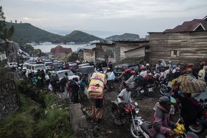 Residents flee Goma, Congo Thursday, May 27, 2021 , five days after Mount Nyiragongo erupted