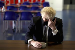 In this Thursday, April 29, 2021 file photo, Britain's Prime Minister Boris Johnson speaks with pupils after taking part in a science lesson, during a visit to King Solomon Academy in London