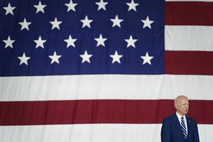 President Joe Biden listens first lady Jill Biden speaks at Joint Base Langley-Eustis in Hampton, Va., Friday, May 28, 2021.