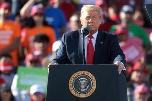 Donald Trump speaking with supporters at a "Make America Great Again" campaign rally at Phoenix Goodyear Airport in Goodyear, Arizona