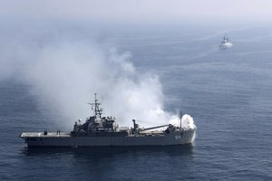 In this photo released Wednesday, Feb. 17, 2021, by the Iranian army, warships participate in a joint naval exercise of the Russian navy, the Iranian navy and the Iranian Revolutionary Guard's navy in the Indian Ocean