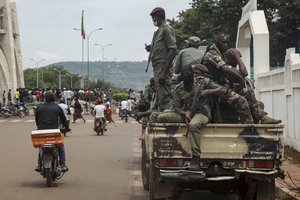 Security forces ride in a truck in the capital Bamako, Mali, Wednesday, Aug. 19, 2020