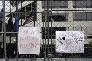 A Justice For George Floyd sign outside the Hennepin County Government Center as closing arguments take place in the Derek Chauvin trial in Minneapolis, Minnesota