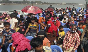 Rohingya refugees are transported on a naval vessel to Bhashan Char, or floating island, in the Bay of Bengal, from Chittagong, Bangladesh, Friday, Dec. 4, 2020.