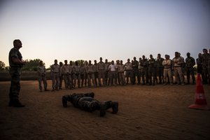 French and U.S. military members are given instruction before a physical training test, Dec. 5, 2013, at a French base near Camp Lemonnier, Djibouti