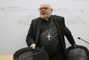 In this Saturday, Feb. 23, 2019 file photo Cardinal Reinhard Marx, the archbishop of Munich and Freising, leaves at the end of a media briefing during a four-day sex abuse summit called by Pope Francis in Rome, Italy