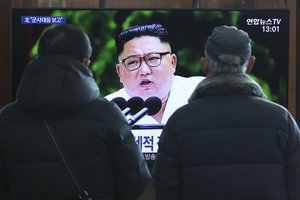 People watch a TV screen showing an image of North Korean leader Kim Jong Un during a news program in Seoul, South Korea