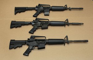 In this Aug. 15, 2012, file photo, three variations of the AR-15 assault rifle are displayed at the California Department of Justice in Sacramento