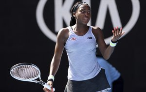 Coco Gauff of the U.S. reacts after losing a point to compatriot Sofia Kenin during their fourth round singles match at the Australian Open tennis championship in Melbourne, Australia, Sunday, Jan. 26, 2020.