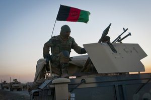 A member of the Afghan National Army mans the gunner's turret of an ANA humvee in the early morning of March 8. The ANA were working with soldiers from 2nd Platoon, Company A, 1st Battalion, 2nd Infantry Regiment, Task Force Blackhawk, to set up traffic check points outside of Combat Outpost Yosef Khel