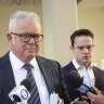 Former WA Treasurer Troy Buswell is approached by media outside a hearing into allegations he assaulted his ex-partner.