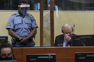 Former Bosnian Serb military chief Ratko Mladic sits in the court room in The Hague, Netherlands, Tuesday, June 8, 2021