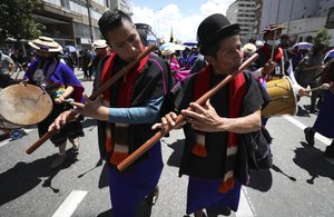 Misak Indigenous play their traditional wooden flutes as they march during an anti-government protest triggered by proposed tax increases on public services, fuel, wages and pensions, in Bogota, Colombia, Wednesday, June 2, 2021.