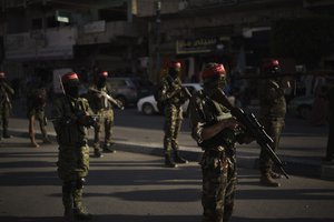 Democratic Front for the Liberation of Palestine (DFLP) militants parade at the streets of Gaza City, Tuesday, June 8, 2021.