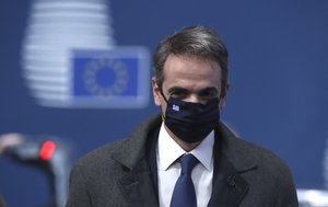 Greek Prime Minister Kyriakos Mitsotakis arrives for an EU summit at the European Council building in Brussels, Thursday, Dec. 10, 2020.