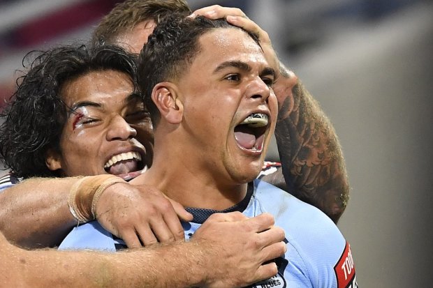 Latrell Mitchell celebrates his first try in a stirring comeback for NSW.