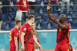 Belgium's Romelu Lukaku, right, salutes supporters at the end of the Euro 2020 soccer championship group B match between Belgium and Russia