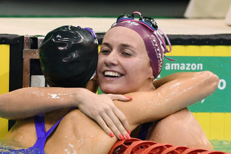 Ariarne Titmus hugs Emma McKeon after the 200m freestyle.