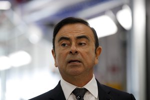 Renault CEO Carlos Ghosn speaks during a visit of French President Emmanuel Macron inside the French carmaker Renault factory of Maubeuge, northern France, Thursday, Nov.8, 2018