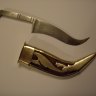 A Kirpan, or ceremonial dagger, is one of five things a baptised Sikh is required to carry on their body.