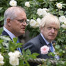 Prime ministers Scott Morrison and Boris Johnson walk to their joint press conference in the Downing Street garden.