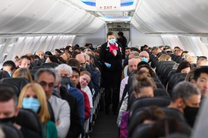 SYDNEY, AUSTRALIA - SEPTEMBER 24: Passengers and crew onboard a Qantas Boeing 737-800, flight number QF735 from Sydney ...