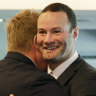 Roosters player Boyd Cordner hugs coach Trent Robinson after announcing his retirement.