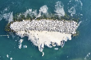 An aerial photo of the sea at the Bostanci shore, in Asian side of Istanbul, Monday, June 7, 2021, with a huge mass of marine mucilage, a thick, slimy substance made up of compounds released by marine organisms, in Turkey's Marmara Sea.