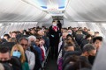 SYDNEY, AUSTRALIA - SEPTEMBER 24: Passengers and crew onboard a Qantas Boeing 737-800, flight number QF735 from Sydney ...