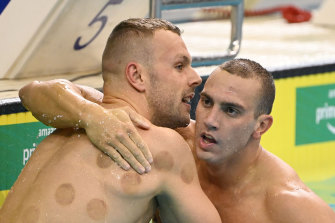 Kyle Chalmers embraces Zac Incerti following the 100m freestyle at the Olympic trials.